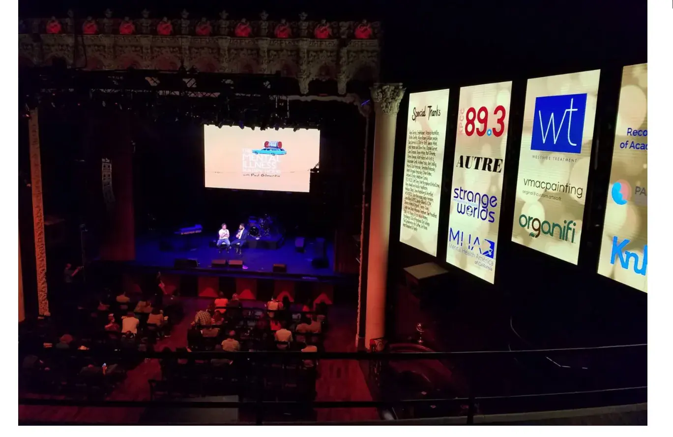 Avalon Theatre stage and audience during a mental-health event